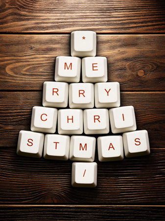 Christmas card - Christmas tree made of computer keys,wooden background