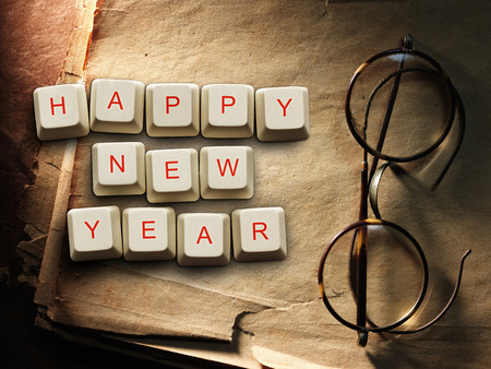 Happy New Year - made of computer keys, Old paper backgroundの写真素材
