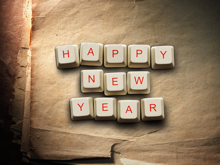 Happy New Year - made of computer keys, Old paper background