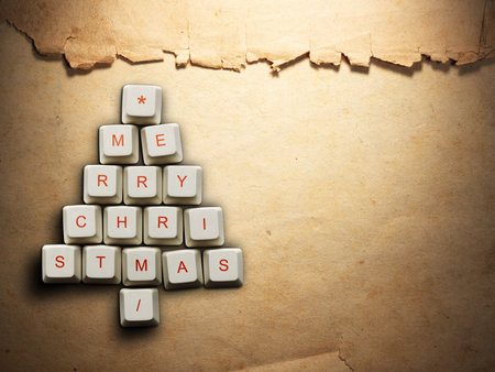 Christmas card - Christmas tree made of computer keys, Old paper background