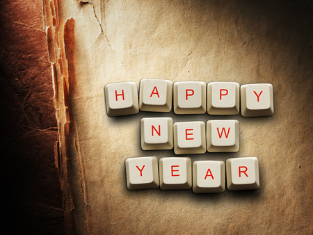 Happy New Year - made of computer keys, Old paper backgroundの写真素材