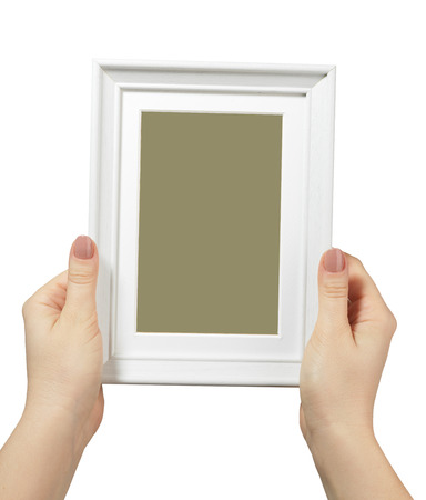 female hand holding a wooden frame isolated on white background. close upの写真素材