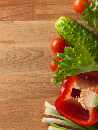 Fresh vegetables on the old wooden board.の写真素材