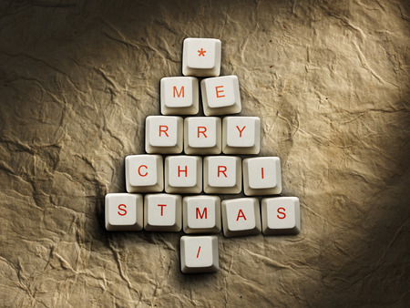 Christmas card - Christmas tree made of computer keys, Old paper backgroundの写真素材