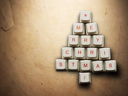 Christmas card - Christmas tree made of computer keys, Old paper backgroundの写真素材