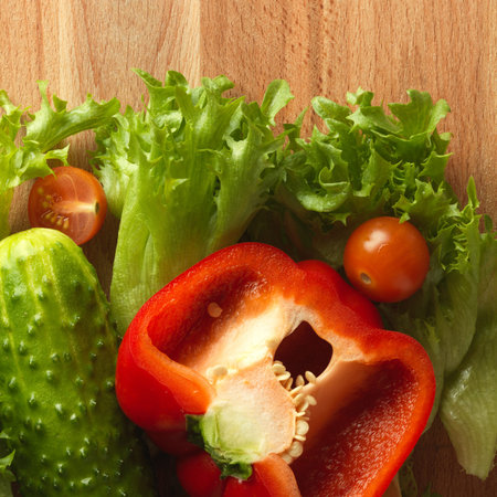 Fresh vegetables on the old wooden board. Healthy food background