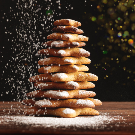 Christmas gingerbread cookies and spices on wooden background. Close-upの写真素材