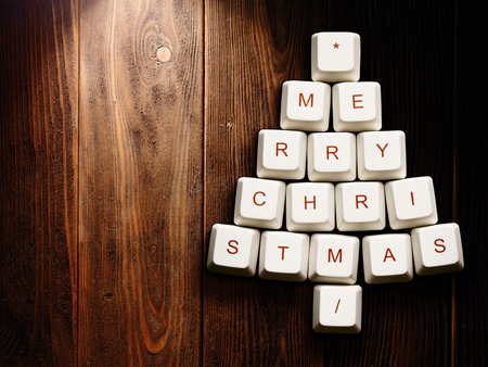 Christmas card - Christmas tree made of computer keys,tree background with vignetteの写真素材