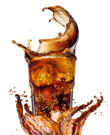 Splash from ice cubes in a glass of cola, isolated on the white background. Closeupの写真素材