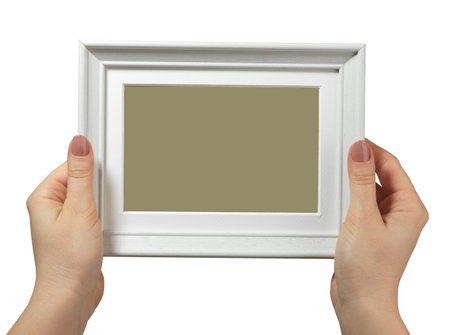 female hand holding a wooden frame isolated on white background. close up