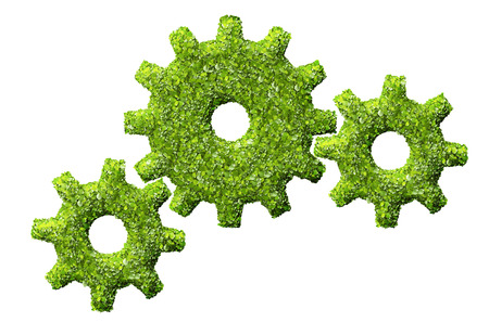 cogs or gears from the green grass. Isolated on whiteの写真素材