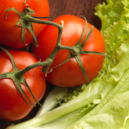 Fresh vegetables on the old wooden board. Healthy food backgroundの写真素材