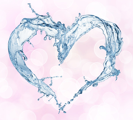 Heart from water splash with bubbles. Bokeh backgroundの写真素材