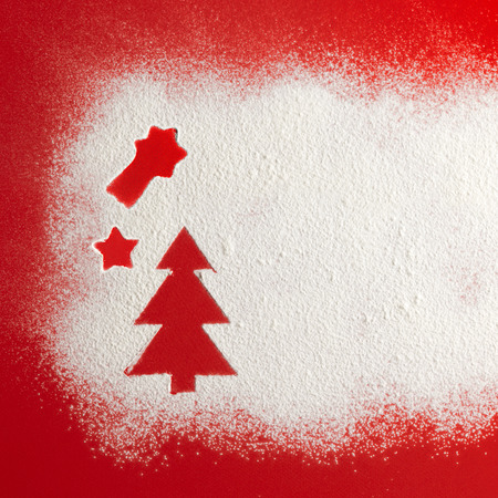 Christmas tree on flour background. White flour looks like snow. Top viewの写真素材