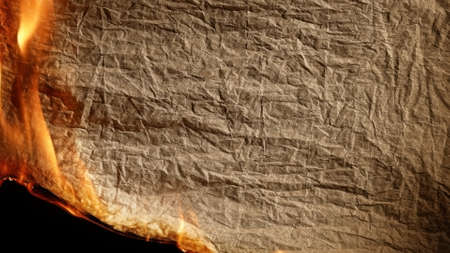 Burning old paper on black backgrounb.の写真素材