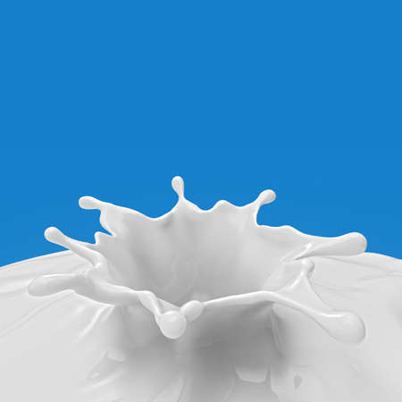 milk or white liquid splash on blue backgroundの写真素材