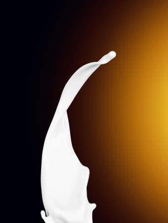 Splash of white fat milk as design element on yellow and brown backgroundの写真素材