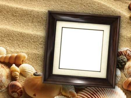 Pictue frame on shells and sand background. Copy space.の写真素材