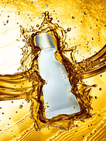 Cream bottle mock up in water splash of yellow color. 3D illustrationの写真素材