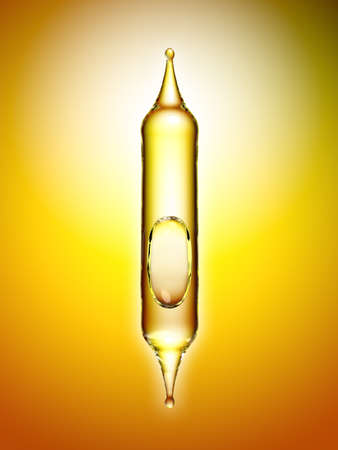 Transparent glass pipette with a Golden liquid dripping. 3d renderingの写真素材