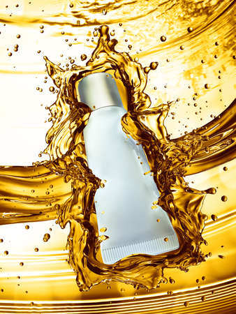 Cream bottle mock up in water splash of yellow color. 3D illustrationの写真素材