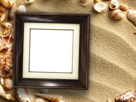 Pictue frame on shells and sand background. Copy space.の写真素材