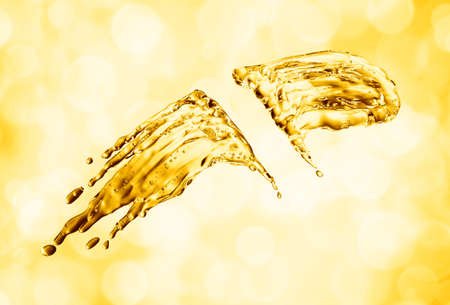 oil splash on gold bokeh background. 3d renderingの写真素材