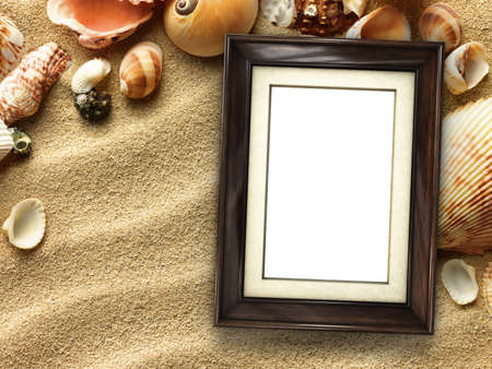 Pictue frame on shells and sand background. Copy space.の写真素材