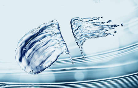 Water splash on blue bokeh background. 3d renderingの写真素材