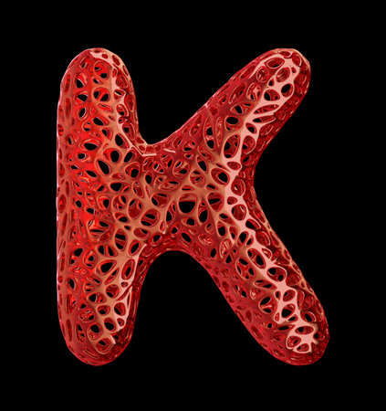 Letter K made of red plastic with abstract holes isolated on black background. 3d renderingの写真素材