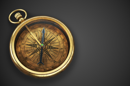 Vintage brass compass isolated on blackの写真素材