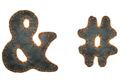 Set of symbols ampersand and hash made of leather. 3D render font with skin texture isolated on white background. 3d renderingの写真素材
