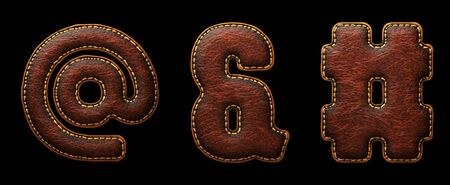 Set of symbols at, ampersand, hash made of leather. 3D render font with skin texture isolated on black background. 3d renderingの写真素材