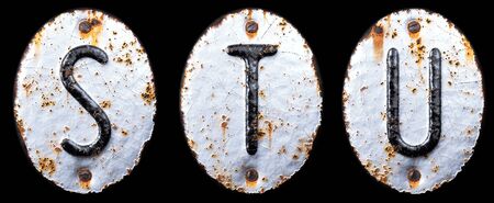3D render set of capital letters S, T, U made of forged metal on the background fragment of a metal surface with cracked rust. 3d renderingの写真素材