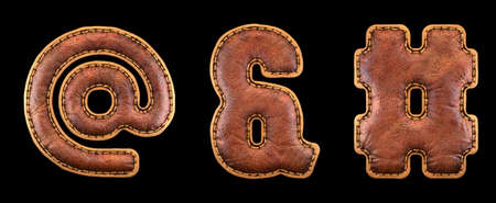 Set of symbols at, ampersand, hash made of leather. 3D render font with skin texture isolated on black background. 3d renderingの写真素材