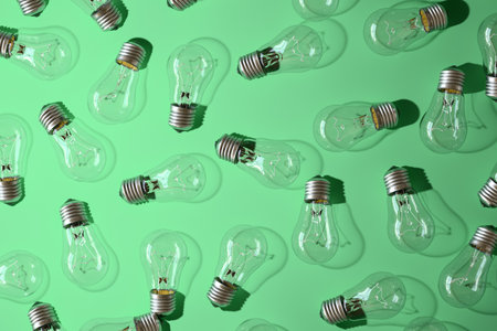 Close-up of an incandescent lamp on green background.の写真素材