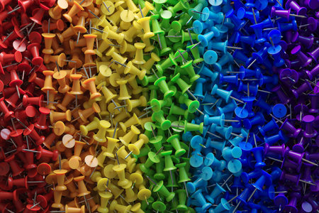 several assorted colors of plastic push pins