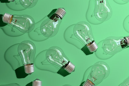 Close-up of an incandescent lamp on green background.の写真素材