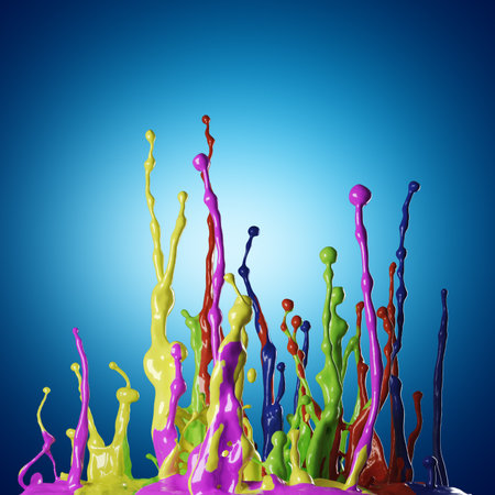 Colored paint splashes on blue backgroundの写真素材
