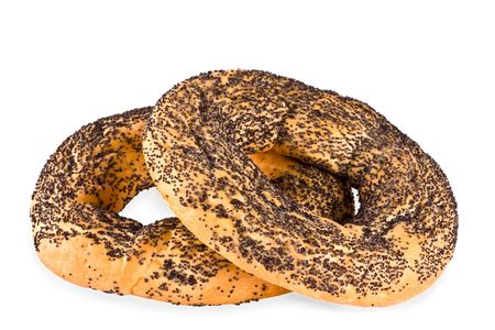 Bagels covered with a poppy on a white backgroundの写真素材
