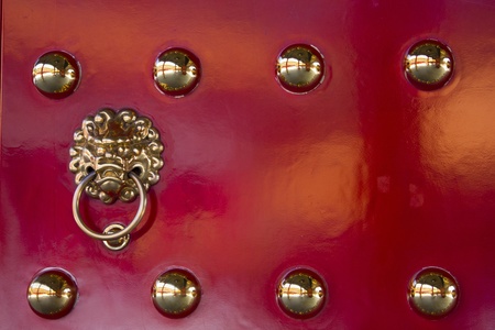 Ornate on red doorの写真素材