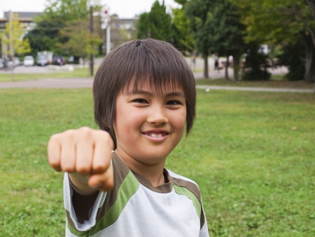 Boy punching with fistの写真素材