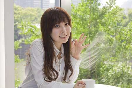 Business woman relaxed with a cup of coffeeの写真素材