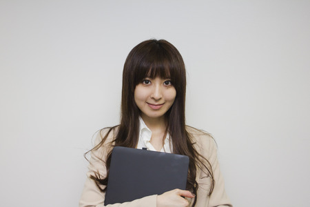 Business woman holding Laptop computerの写真素材