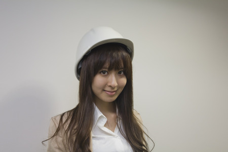 Business woman wearing helmetの写真素材