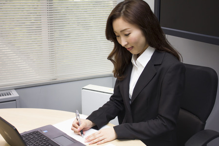 Young businesswoman working in front of a computerの写真素材