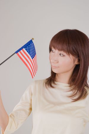 Young woman holding American Flagのeditorial素材