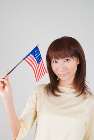 Young woman holding American Flagのeditorial素材