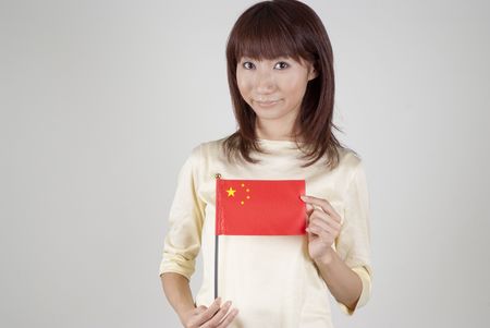 Young woman holding Chinese flagのeditorial素材