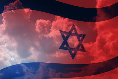 The national flag of Israel against a blue and red skyの写真素材